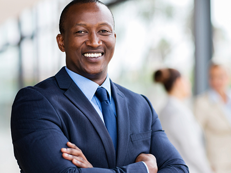 business-landing-contact-us Man smiling in suite